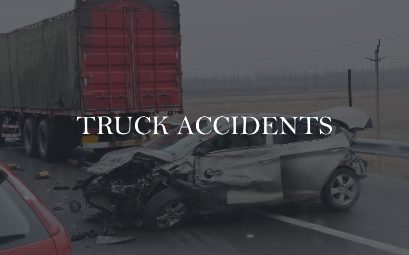 Scene of a serious truck accident involving an 18-wheeler and passenger vehicle — highlighting legal representation for victims of commercial vehicle crashes. Personal injury lawyers help clients injured in semi-truck collisions pursue compensation for medical expenses, lost income, and long-term recovery.